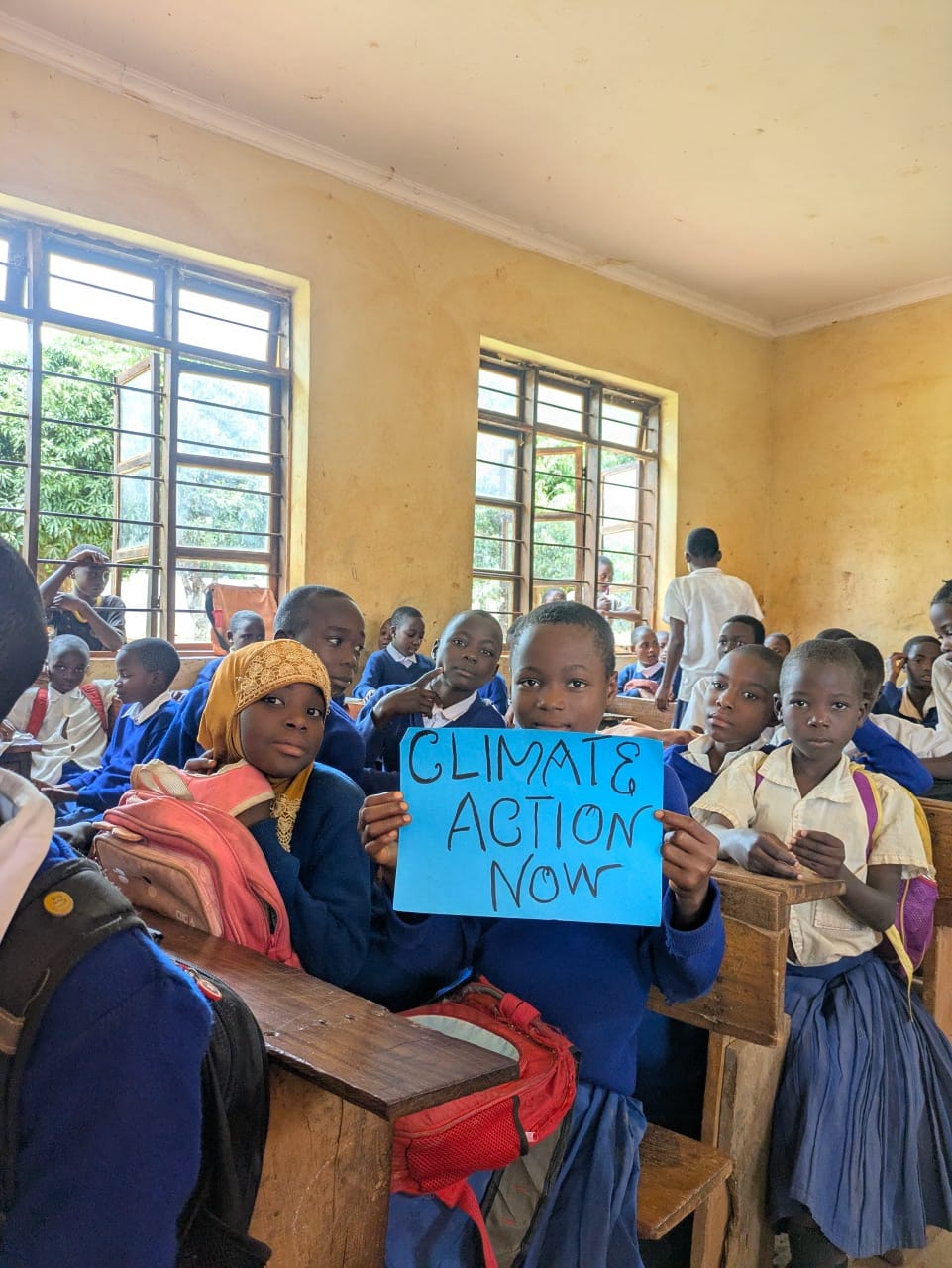 Student holding a climate action sign